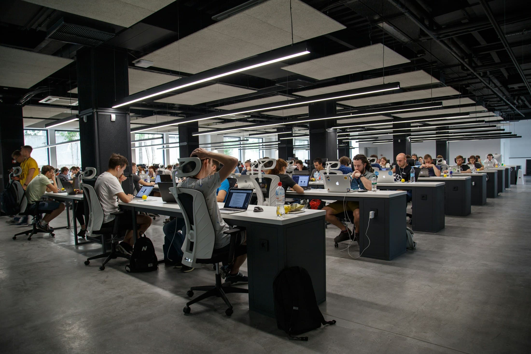 Operational environment with people coordinating work across an active floor